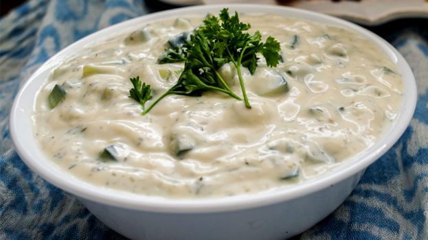 It's served on the side with warm pita bread triangles for dipping, and is also used as a condiment for souvlaki